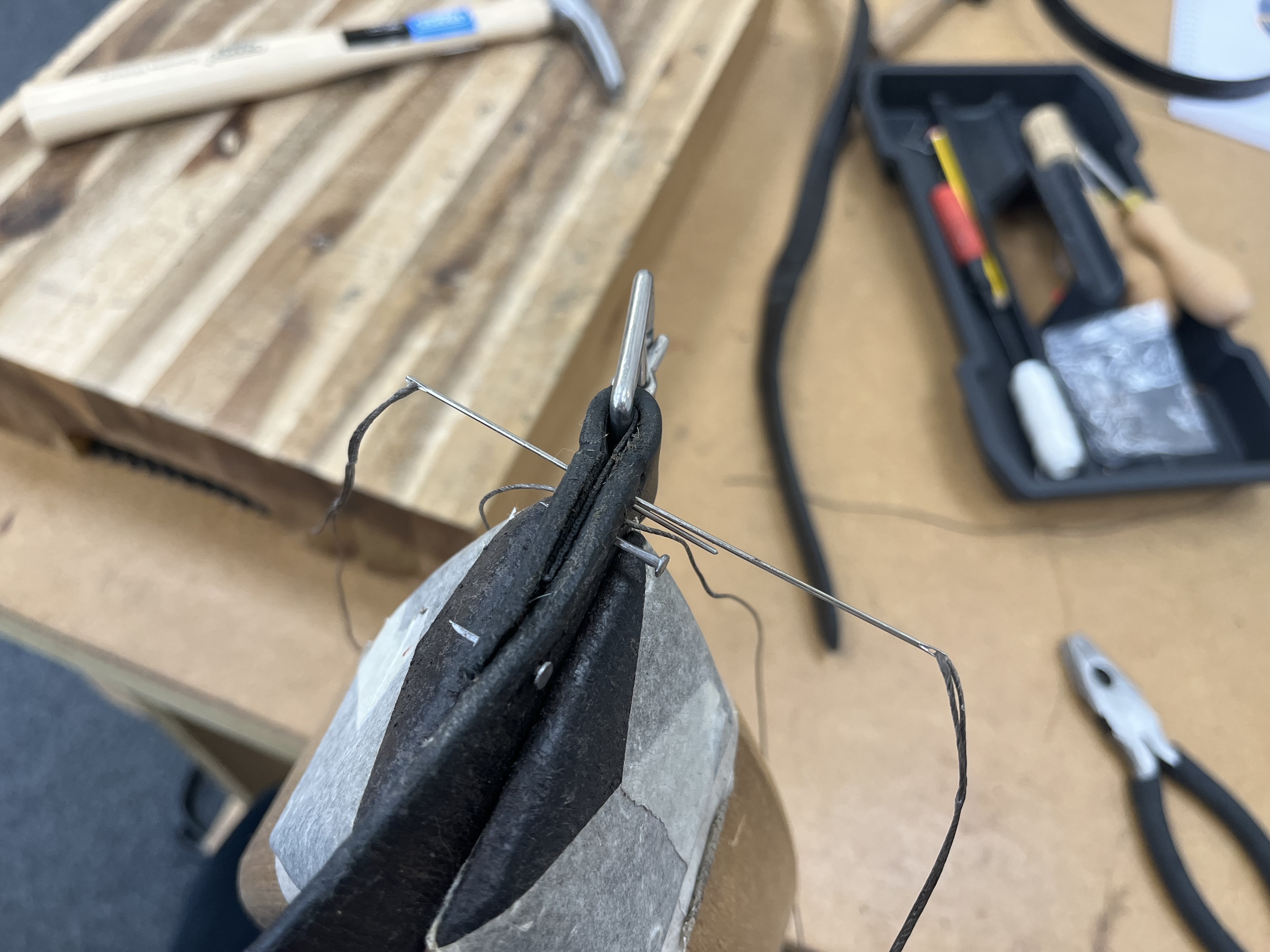 Hand stitching leather by hand